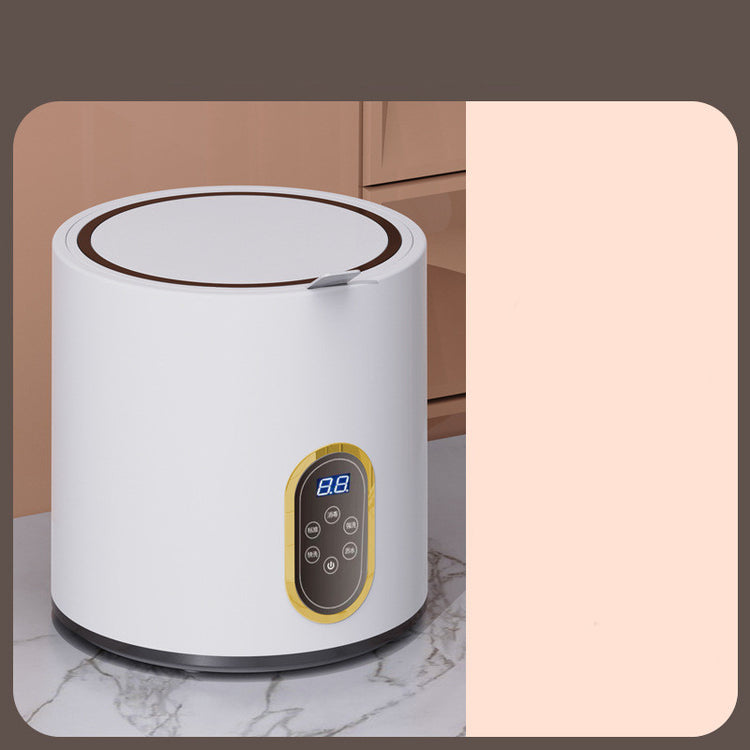 Mini automatic washing machine for children with compact design, white exterior, control panel, and small drum for easy use.