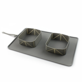 Silicone folding pet bowl by Bucciato, portable and flexible for pets, with a wide base and collapsible design for travel convenience.