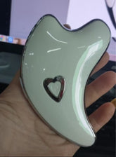 Bucciato Gua Sha facial massager with LED light microcurrent skin rejuvenation and face lifting features.