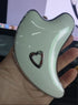 Bucciato Gua Sha facial massager with LED light microcurrent skin rejuvenation and face lifting features.