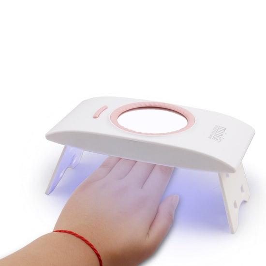 Foldable portable nail phototherapy machine by Bucciato, compact design with LED light for effective nail treatment.