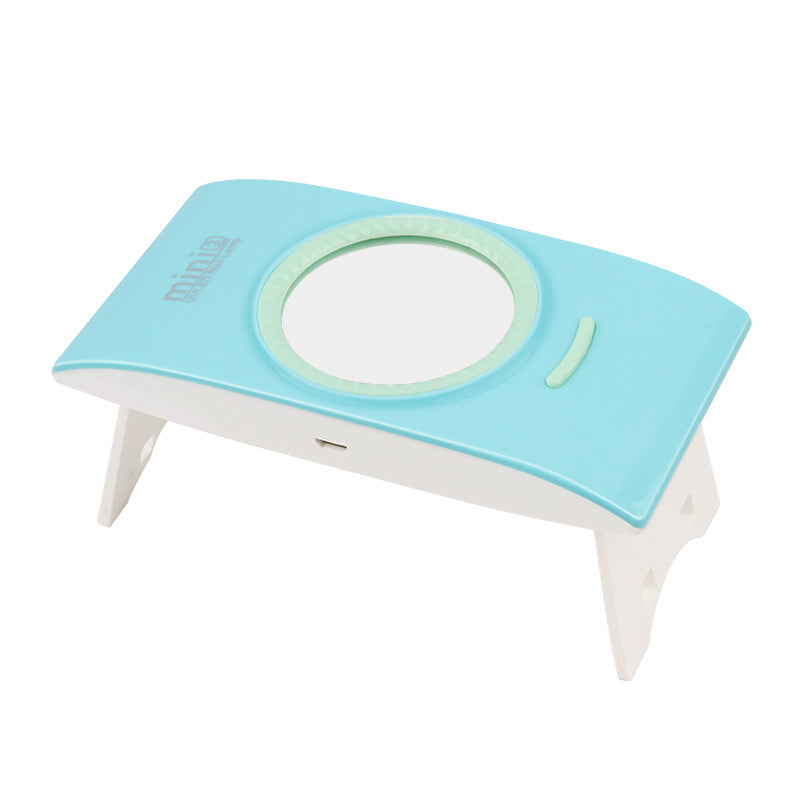 Foldable portable nail phototherapy machine by Bucciato, compact design with LED light for effective nail treatment.