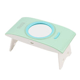 Foldable portable nail phototherapy machine by Bucciato, showing compact design and LED light for nail treatment.