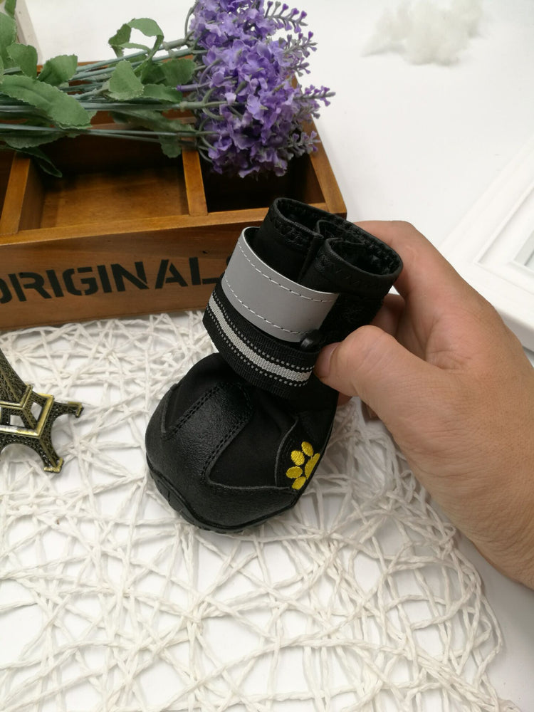 Dog pet shoes worn on paws, lightweight dog shoes designed for comfort and protection, in a neutral color.