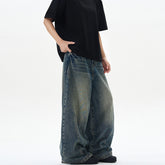 Vintage blue washed tie-dye bootcut jeans by Bucciato, showing relaxed fit and faded denim with a stylish distressed look.