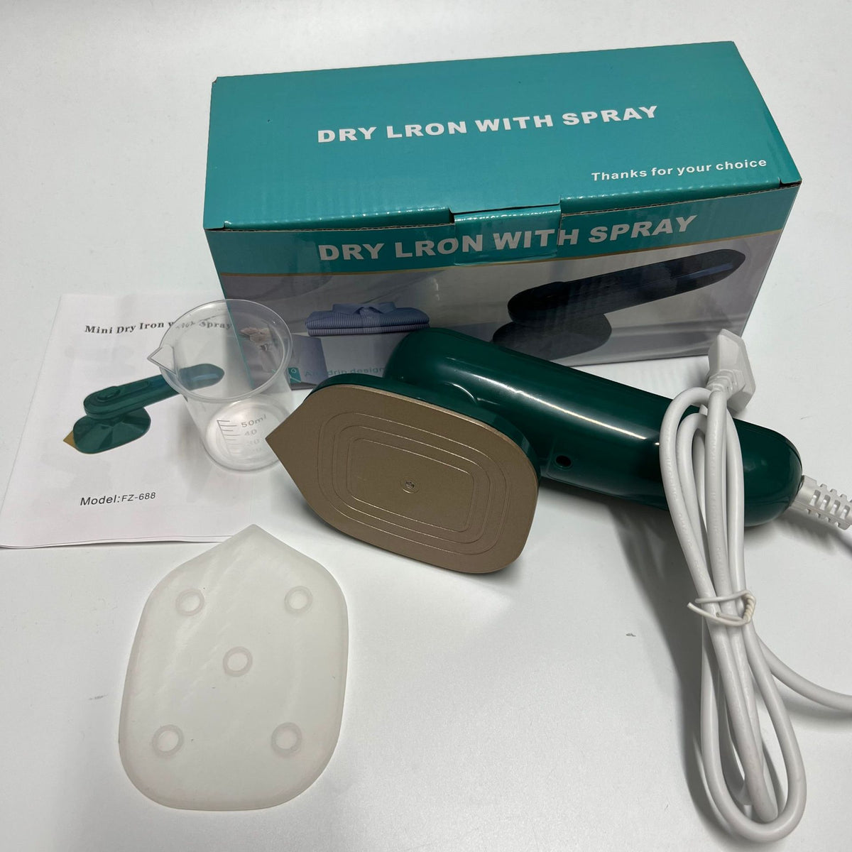 Handheld portable garment ironing machine with steam, compact electric mini iron for travel and household use.
