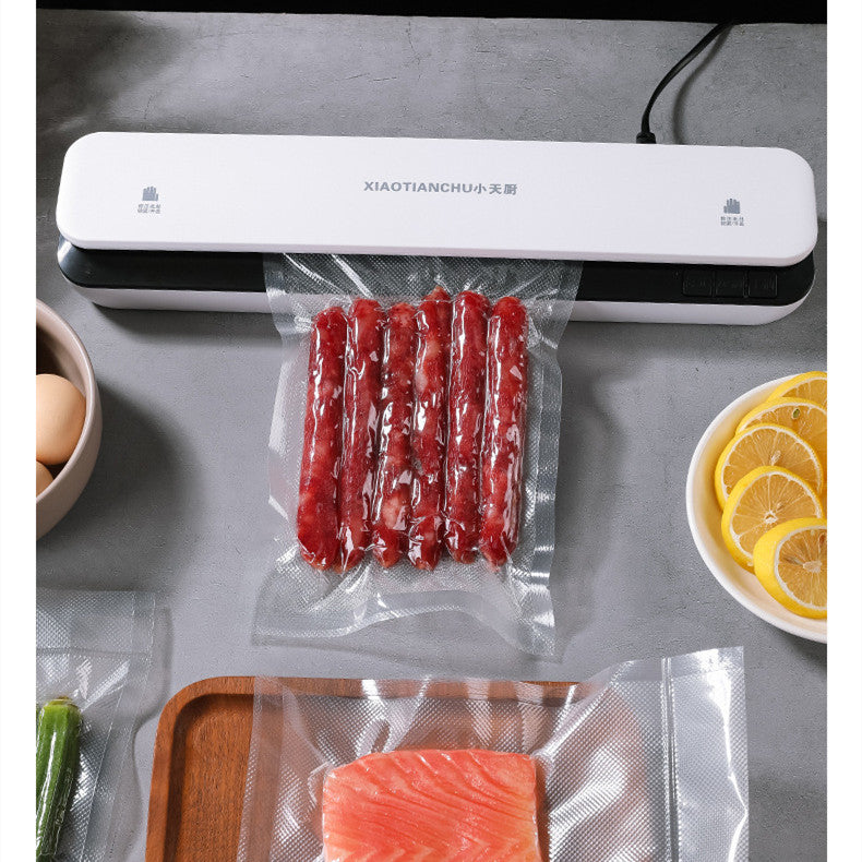 Small Bucciato household vacuum packaging machine with control panel and sealing chamber for food preservation.