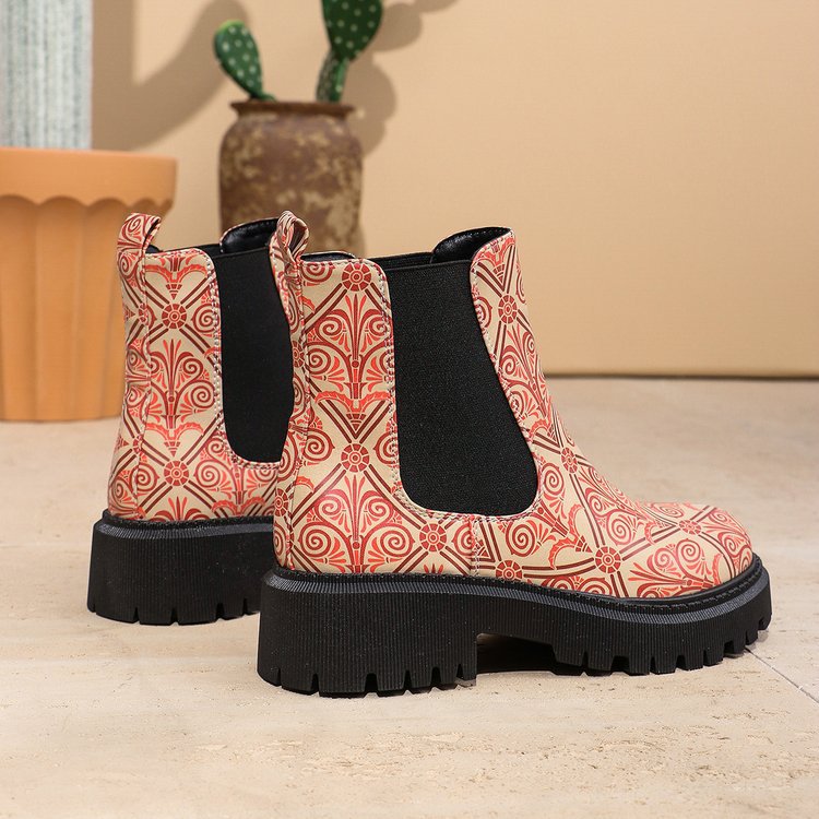Printed plus-size shaft boots for women featuring bold patterns, high heels, and a stylish design in black and white.