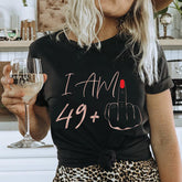Women’s loose T-shirt with letter print, casual crew-neck top in soft fabric, featuring colorful letter designs on front.