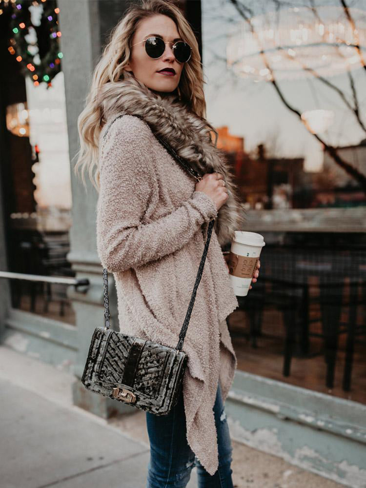 Women’s plush trench coat with fur collar in neutral tones, stylish outerwear by Bucciato featuring a classic design.