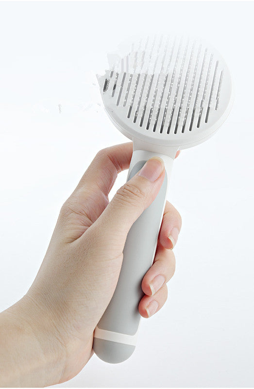 Round handle pet massage comb from Bucciato with fine teeth for gentle grooming and massage of dogs and cats.