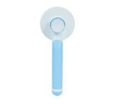 Round handle pet massage comb with ergonomic grip, designed to gently groom and soothe cats and dogs.