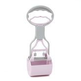 Dog poop picker tool from Bucciato, a pet waste pickup accessory with a handle and scoop for easy cleaning during walks.