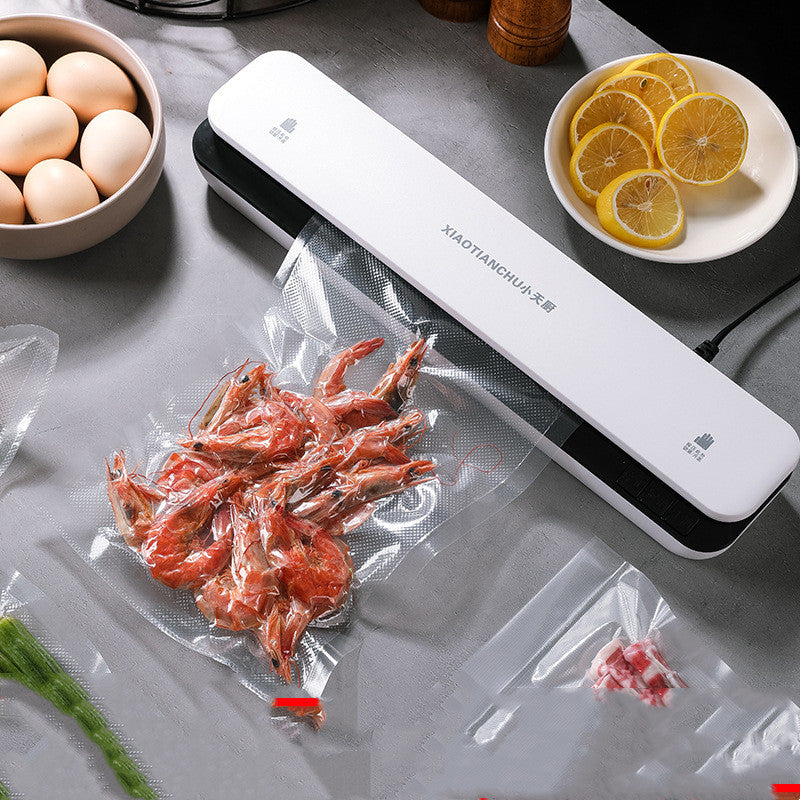 Mini household vacuum packaging machine by Bucciato, compact design with sealing chamber for food storage and preservation.