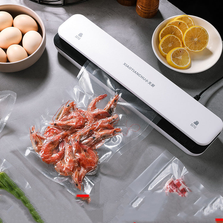 Mini household vacuum packaging machine by Bucciato, compact design with sealing chamber for food storage and preservation.