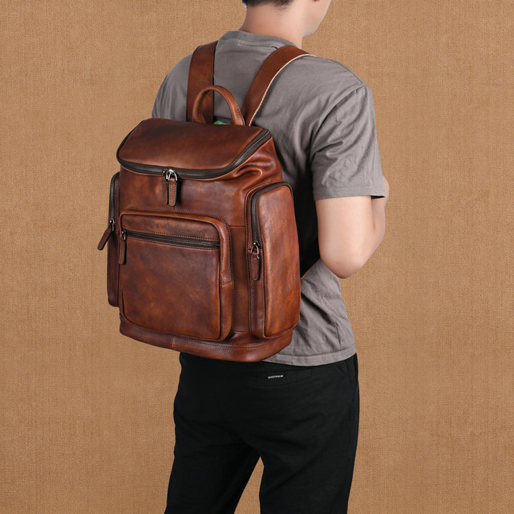Genuine retro double-layer cowhide backpack for men, outdoor leisure travel bag with sturdy leather design and multiple compartments.