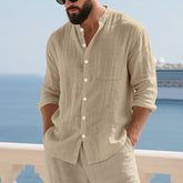 Men’s breathable linen button-up shirt with stand collar and long sleeves, stylishly displayed in the image.