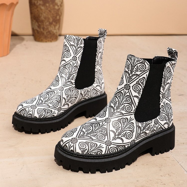 Printed plus-size shaft boots for women with bold patterns and comfortable fit, featuring a stylish design.