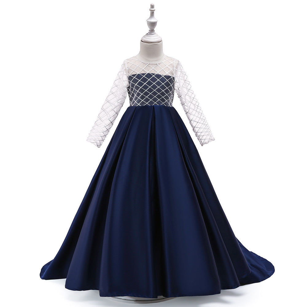 Girls’ mesh long sleeve trailing dress by Bucciato, stylish occasion wear with delicate mesh fabric and flowing design.