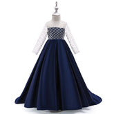 Girls’ mesh long sleeve trailing dress by Bucciato, stylish occasion wear with delicate mesh fabric and flowing design.