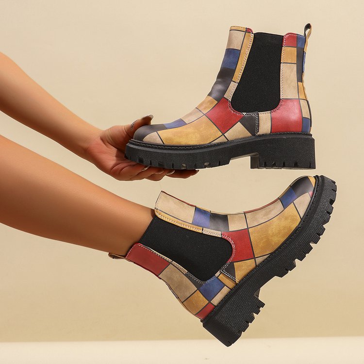 Printed plus-size shaft boots for women featuring bold patterns and a comfortable fit, stylishly displayed on a plain background.