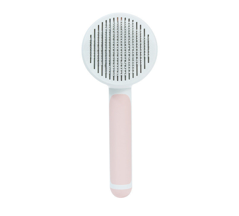 Round handle pet massage comb by Bucciato, featuring fine teeth for gentle grooming and relaxing pet massage.