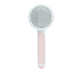 Round handle pet massage comb by Bucciato, featuring fine teeth for gentle grooming and relaxing pet massage.