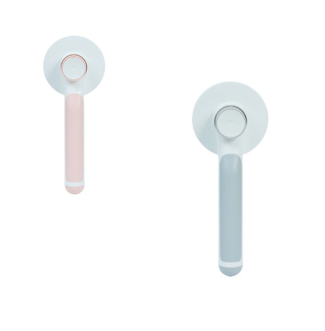 Round handle pet massage comb with metal teeth for gentle grooming and relaxing pet massages.