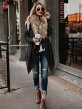 Women’s plush trench coat with fur collar, stylish outerwear by Bucciato featuring a cozy and elegant design.