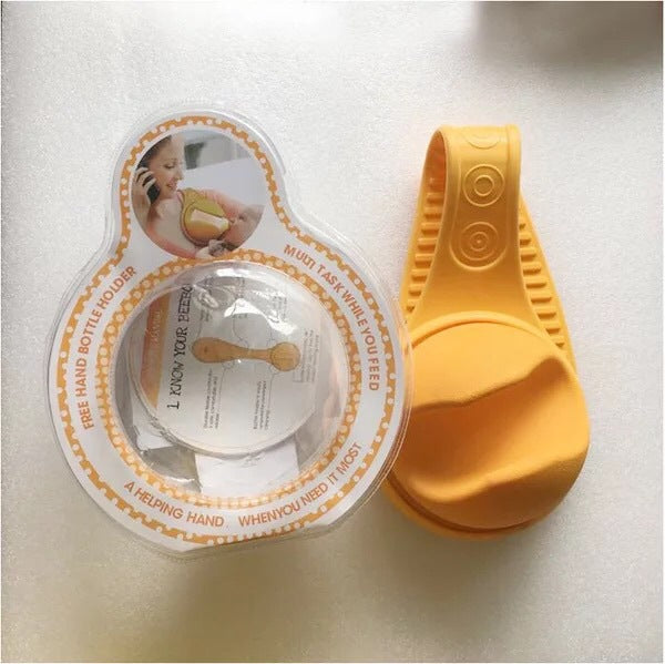 Baby bottle holder from Bucciato, hands-free feeding accessory with adjustable strap and secure grip for easy baby feeding.