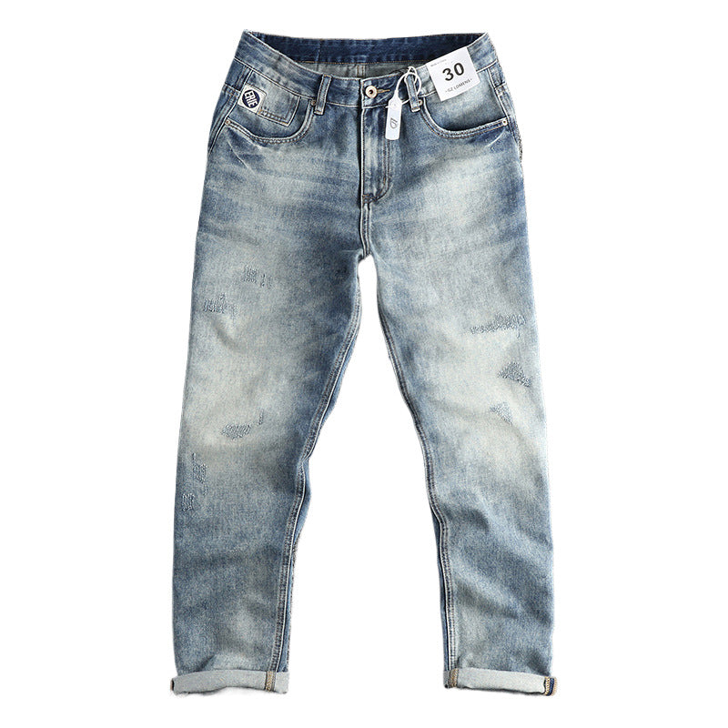 American Retro washed jeans for men featuring distressed denim and classic fit, displayed on a hanger.