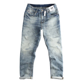 American Retro washed jeans for men featuring distressed denim and classic fit, displayed on a hanger.