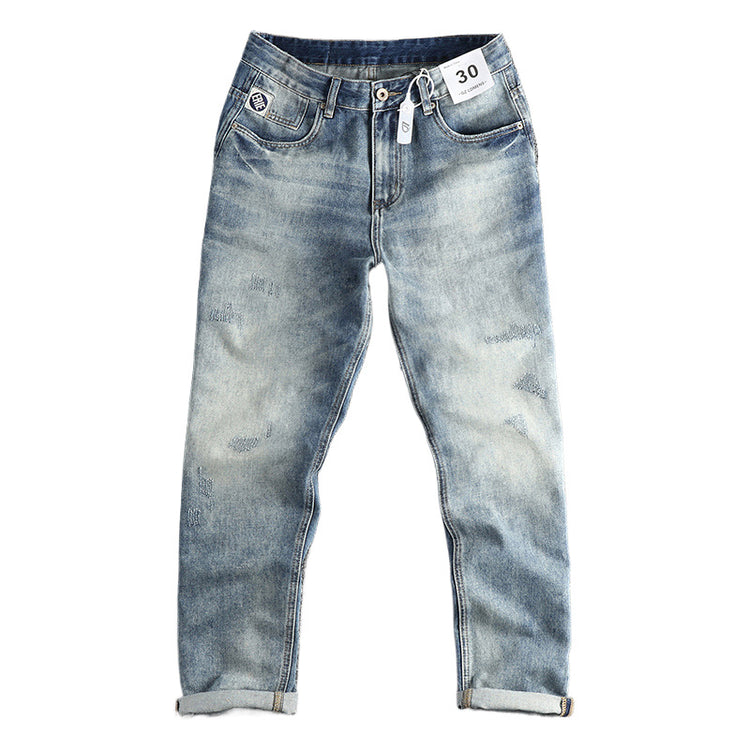 American Retro washed jeans for men featuring distressed denim and classic fit, displayed on a hanger.