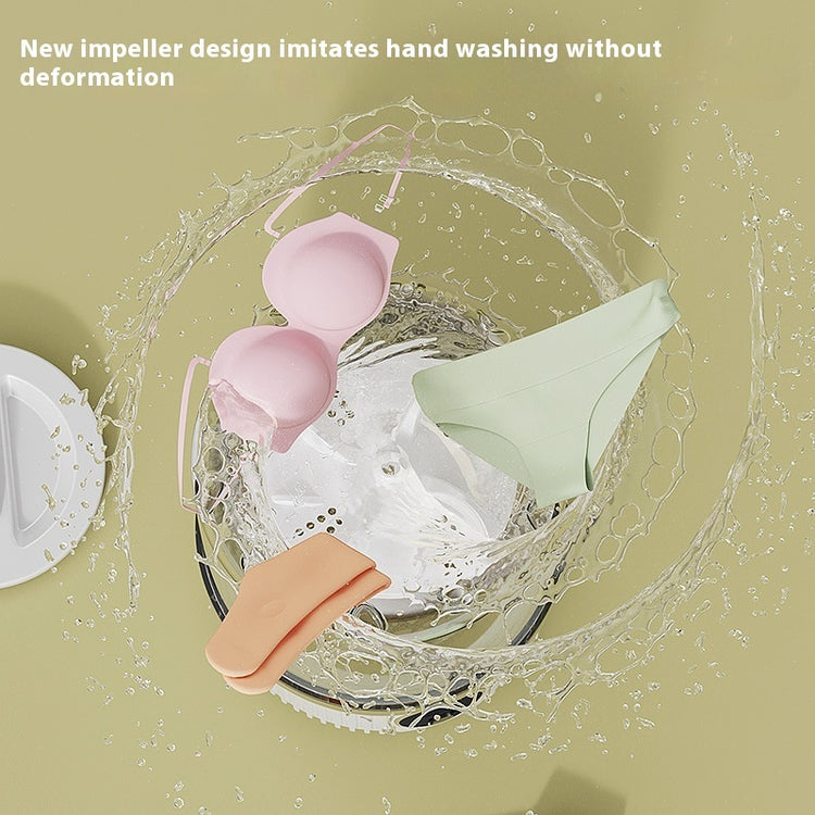 Small wireless underwear washing machine by Bucciato, compact appliance with a sleek design suited for quick laundry of underwear.