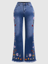 High-elasticity embroidered flared jeans for women, luxury designer denim with detailed embroidery, black color, fitted waist, and flared legs.