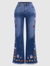 High-elasticity embroidered flared jeans for women, luxury designer denim with detailed embroidery, black color, fitted waist, and flared legs.