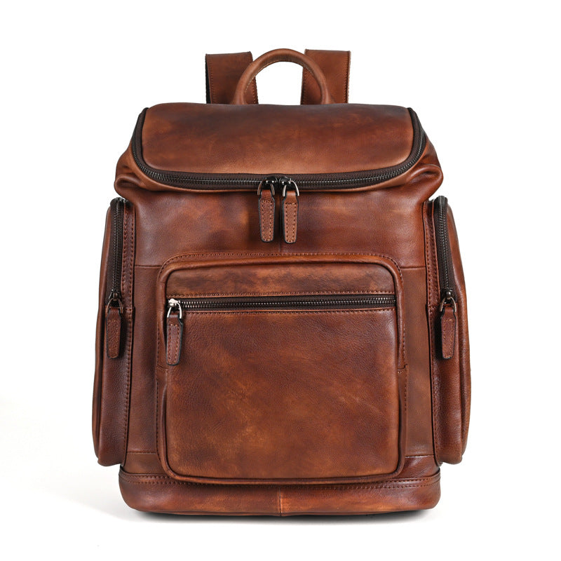 Genuine retro double-layer cowhide backpack for men, outdoor leisure travel bag in brown with adjustable straps and multiple compartments.