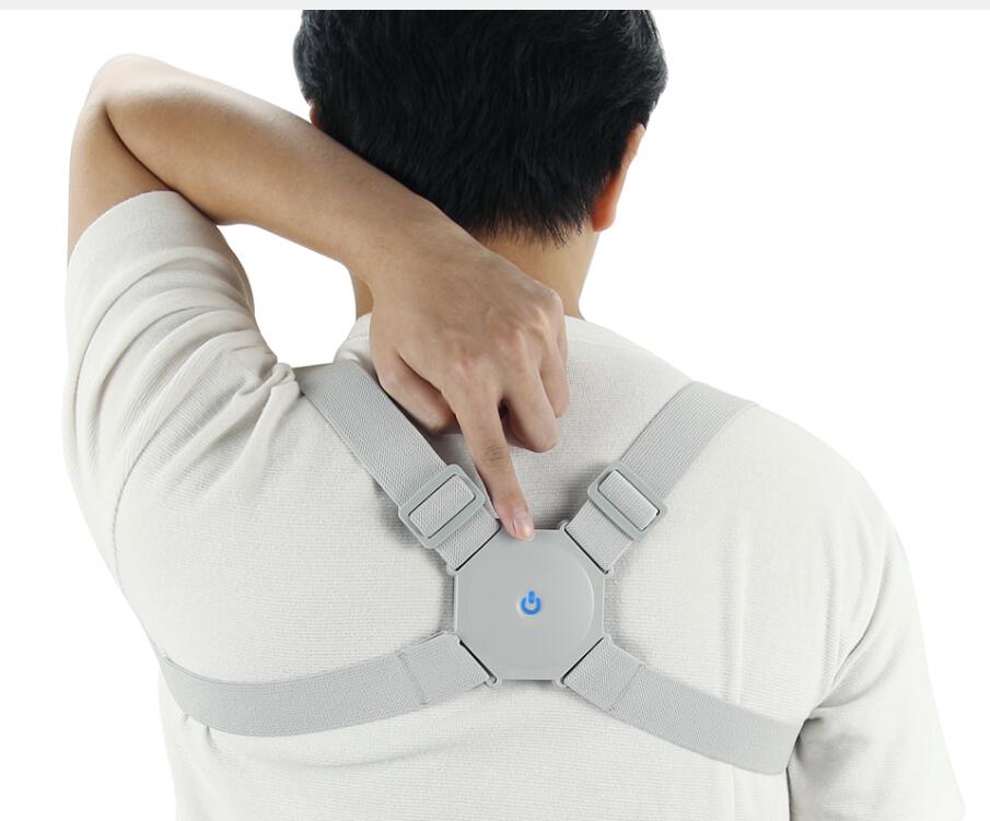 Adjustable smart back posture corrector in black, designed to improve posture and support the upper back.