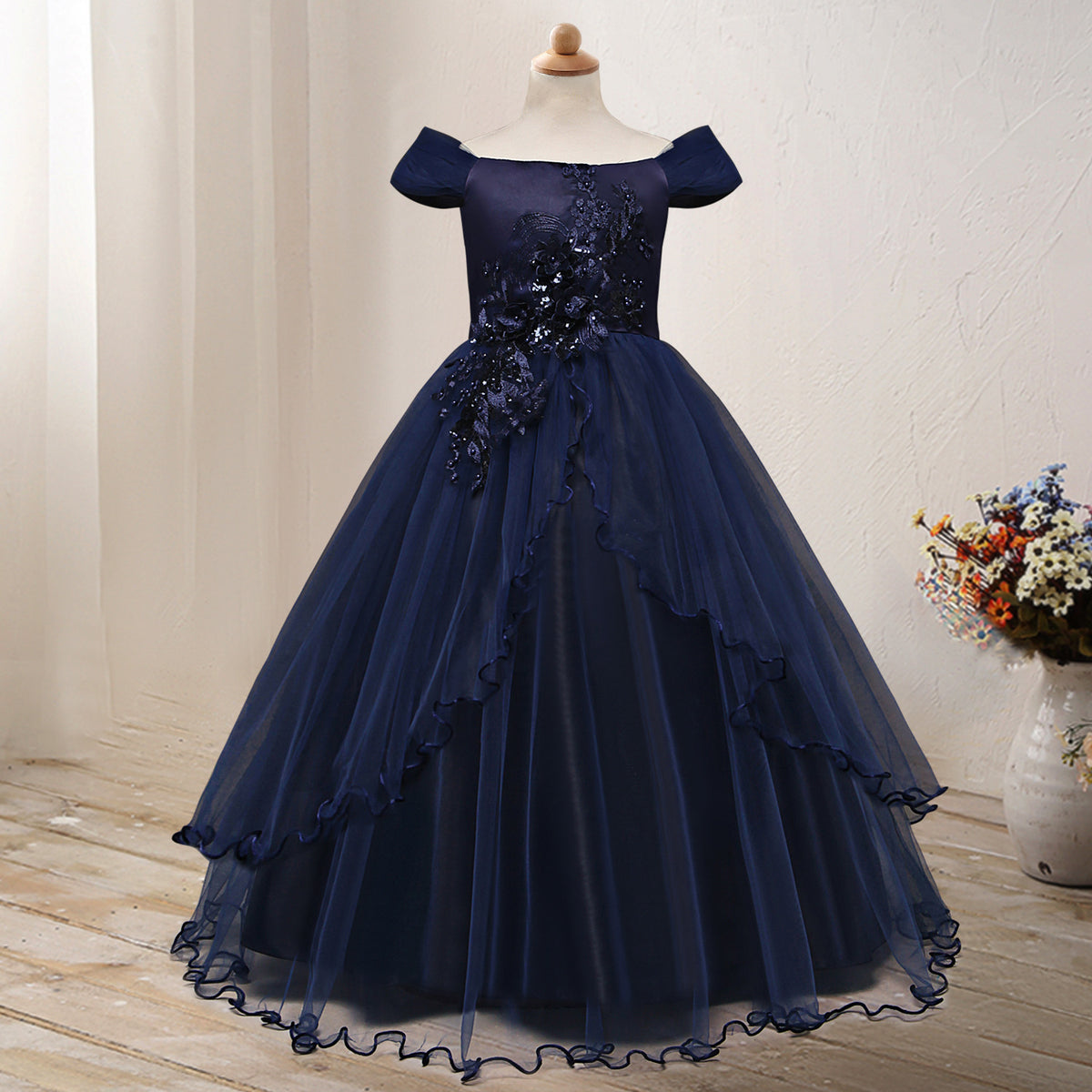 One-shoulder princess flower dress costume by Bucciato, featuring colorful floral details and a flowing fabric design.