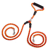 Double-ended dog traction rope with handles for walking, made of durable material, ideal for controlling pets during walks.