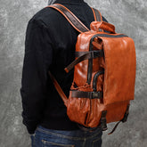 Large cowhide flip shoulder computer bag with multiple compartments, designed for carrying laptops and accessories in a stylish manner.