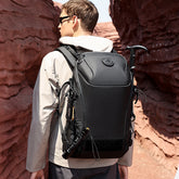 High-capacity multi-functional outdoor adventure backpack with multiple compartments and sturdy straps, ideal for hiking and camping.