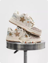 Pair of high-end Bucciato platform sneakers with star pattern, featuring a stylish design for couples.