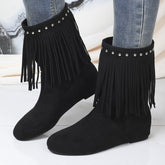 Plus size studded suede tassel boots for women featuring decorative metal studs and tassel details in a stylish design.