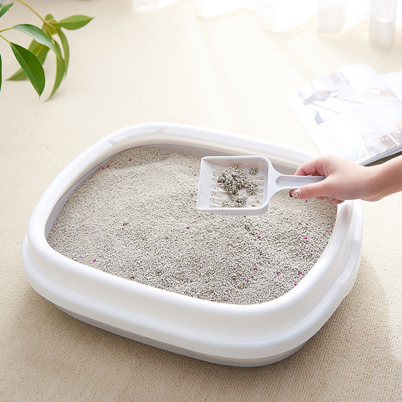 High-quality Bucciato pet toilet cat litter box with scoop, anti-splash plastic design for easy cleaning and odor control.