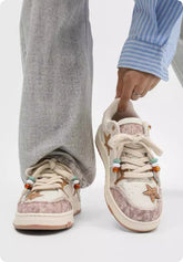 Pair of black platform sneakers with star pattern from Bucciato, featuring a trendy high-end design for couples.