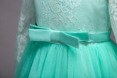 Long flower girl dress for kids by Bucciato, featuring a flowing design with floral details and pastel colors.