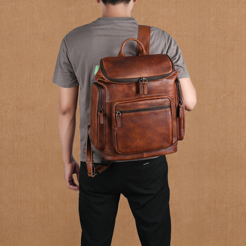 Genuine retro double-layer cowhide backpack for men with outdoor leisure style, featuring sturdy leather construction and multiple compartments.