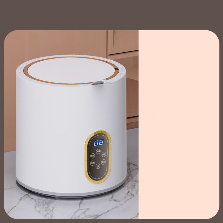 Small mini automatic washing machine for children by Bucciato, compact appliance with control panel and drum for laundry.