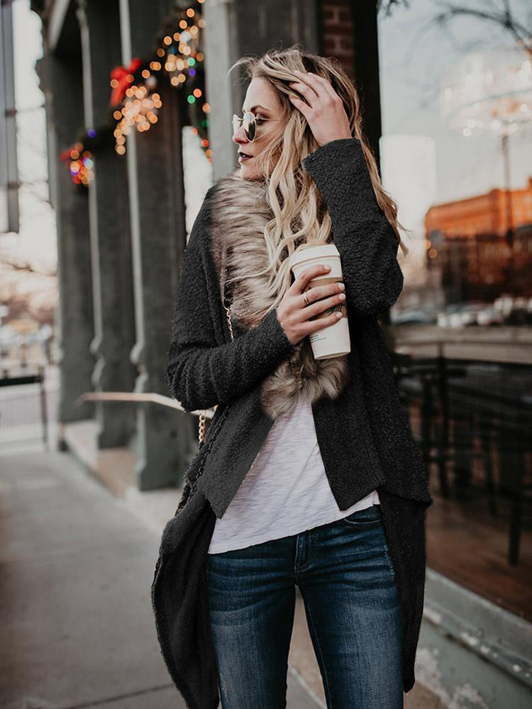 Women’s plush trench coat with fur collar, stylish outerwear by Bucciato featuring a cozy, elegant design and button details.